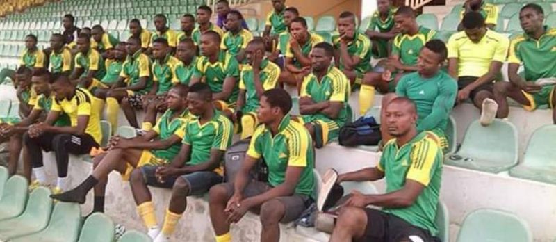 Kwara State football players sitting down in the stadium